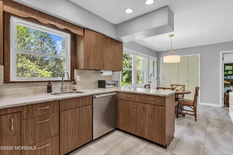 a kitchen with a sink and cabinets
