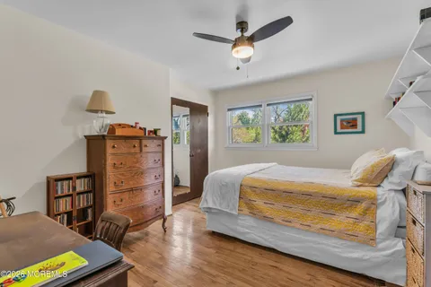 a bedroom with a bed furniture and a window