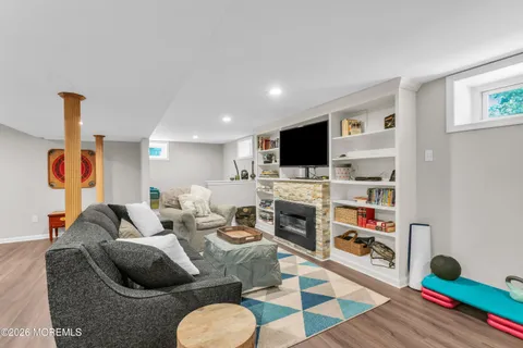 a living room with furniture and a fireplace