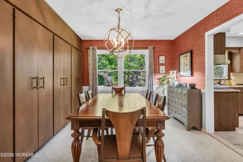 a dining room with furniture window and outside view