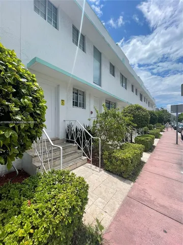 a house view with a garden space