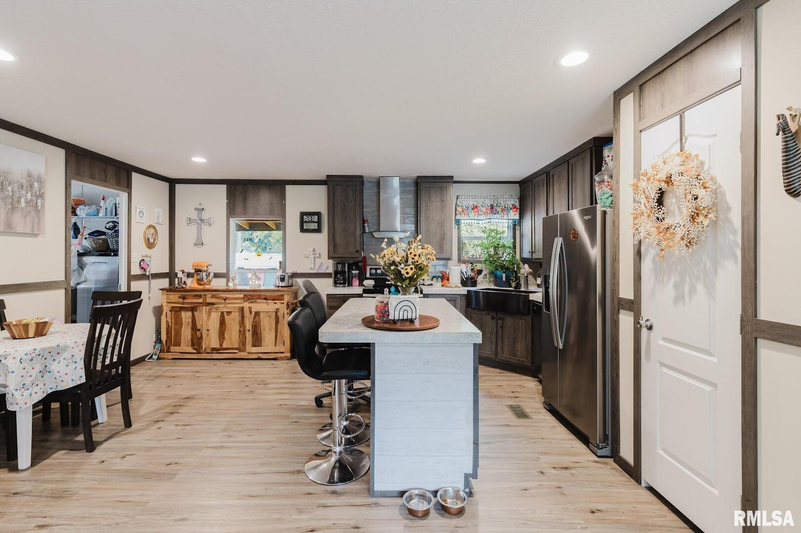 344 Seba Street Hurst, IL 62949 - Photo 10 of 34 a view of kitchen with refrigerator stove dining table and chairs
