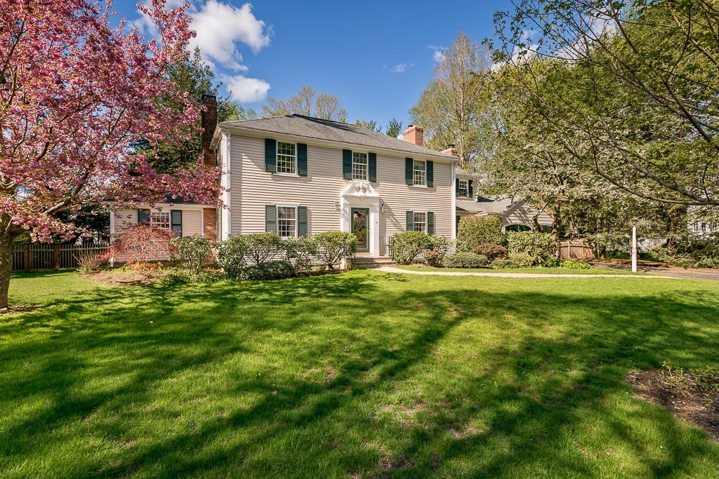 73 Audubon Road Wellesley, MA 02481 - Photo 1 of 24 a front view of house with yard and green space