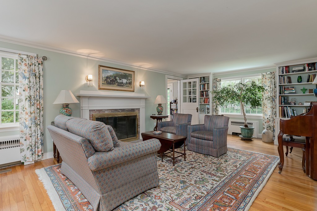 73 Audubon Road Wellesley, MA 02481 - Photo 12 of 24 a living room with furniture and a fireplace