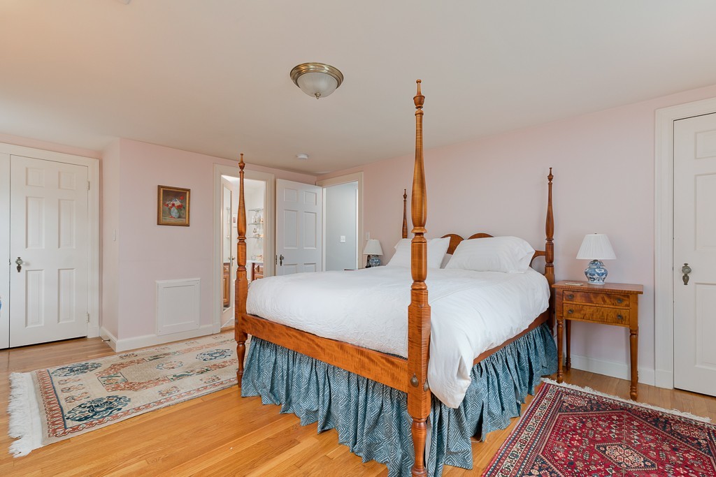 73 Audubon Road Wellesley, MA 02481 - Photo 16 of 24 a bedroom with bed and a table