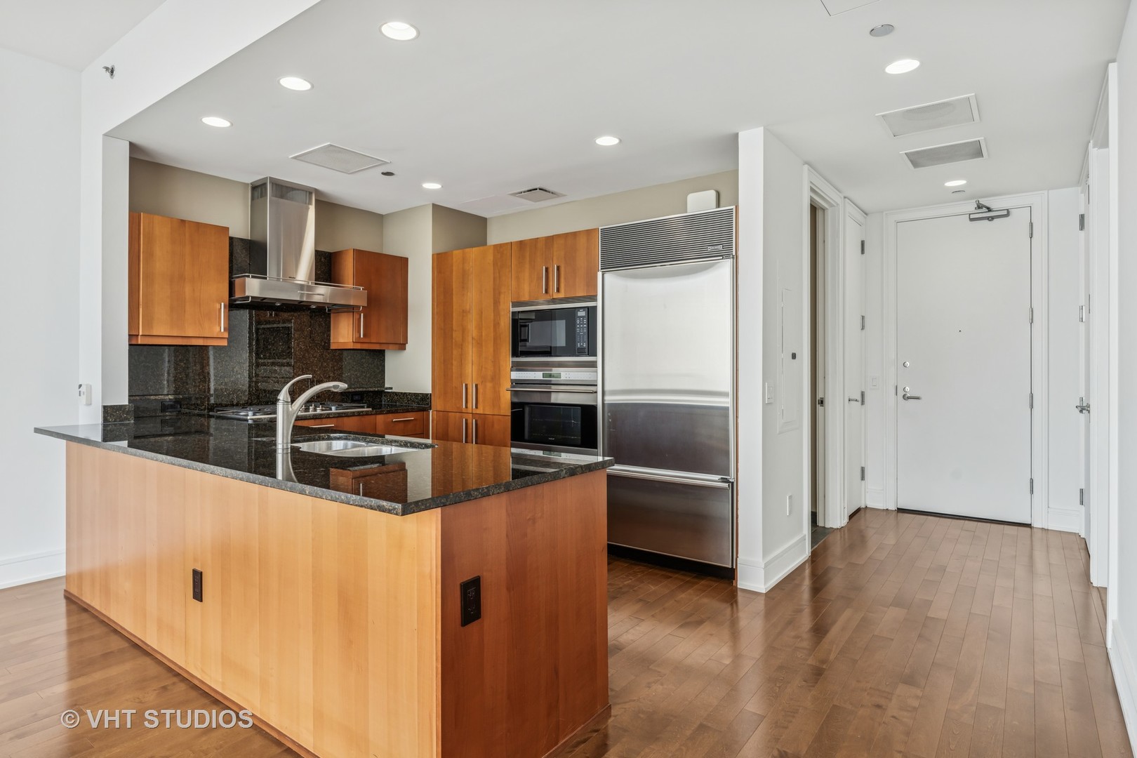 401 North Wabash Avenue, Unit 83E Chicago, IL 60611 - Photo 5 of 33 a kitchen with stainless steel appliances granite countertop a refrigerator and a sink