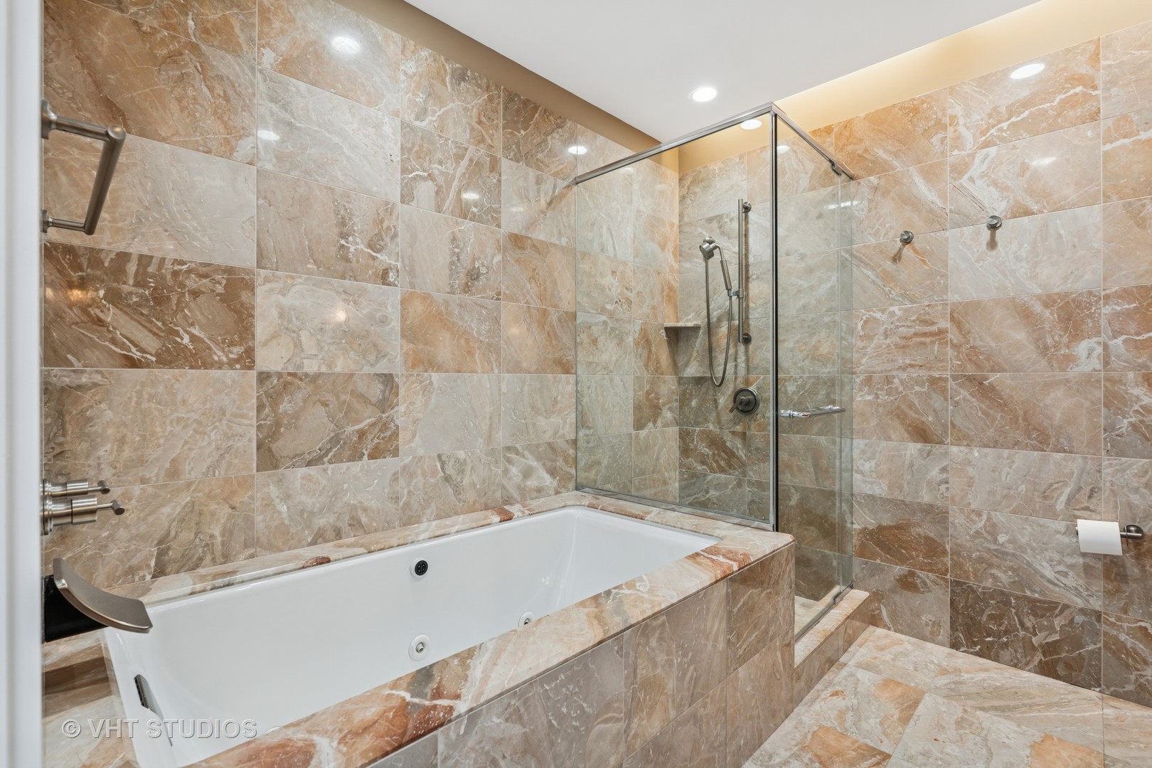 401 North Wabash Avenue, Unit 83E Chicago, IL 60611 - Photo 8 of 33 a bathroom with a bathtub and shower