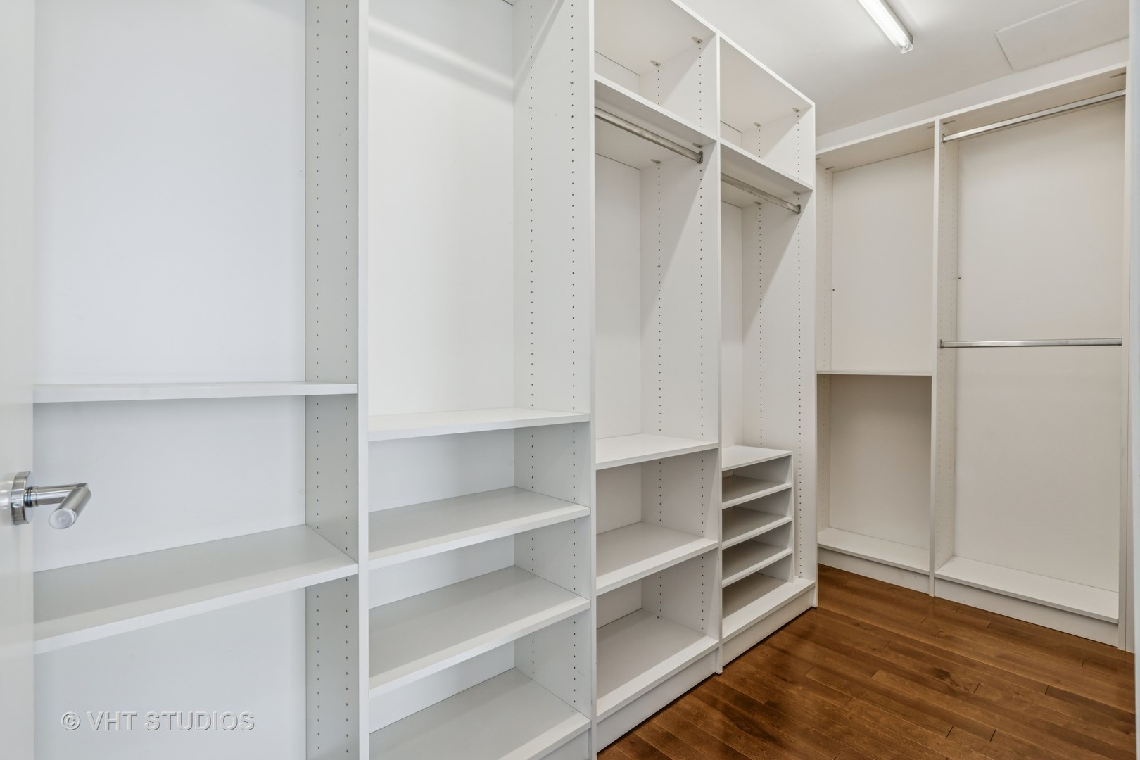 401 North Wabash Avenue, Unit 83E Chicago, IL 60611 - Photo 9 of 33 a view of walk in closet with empty racks