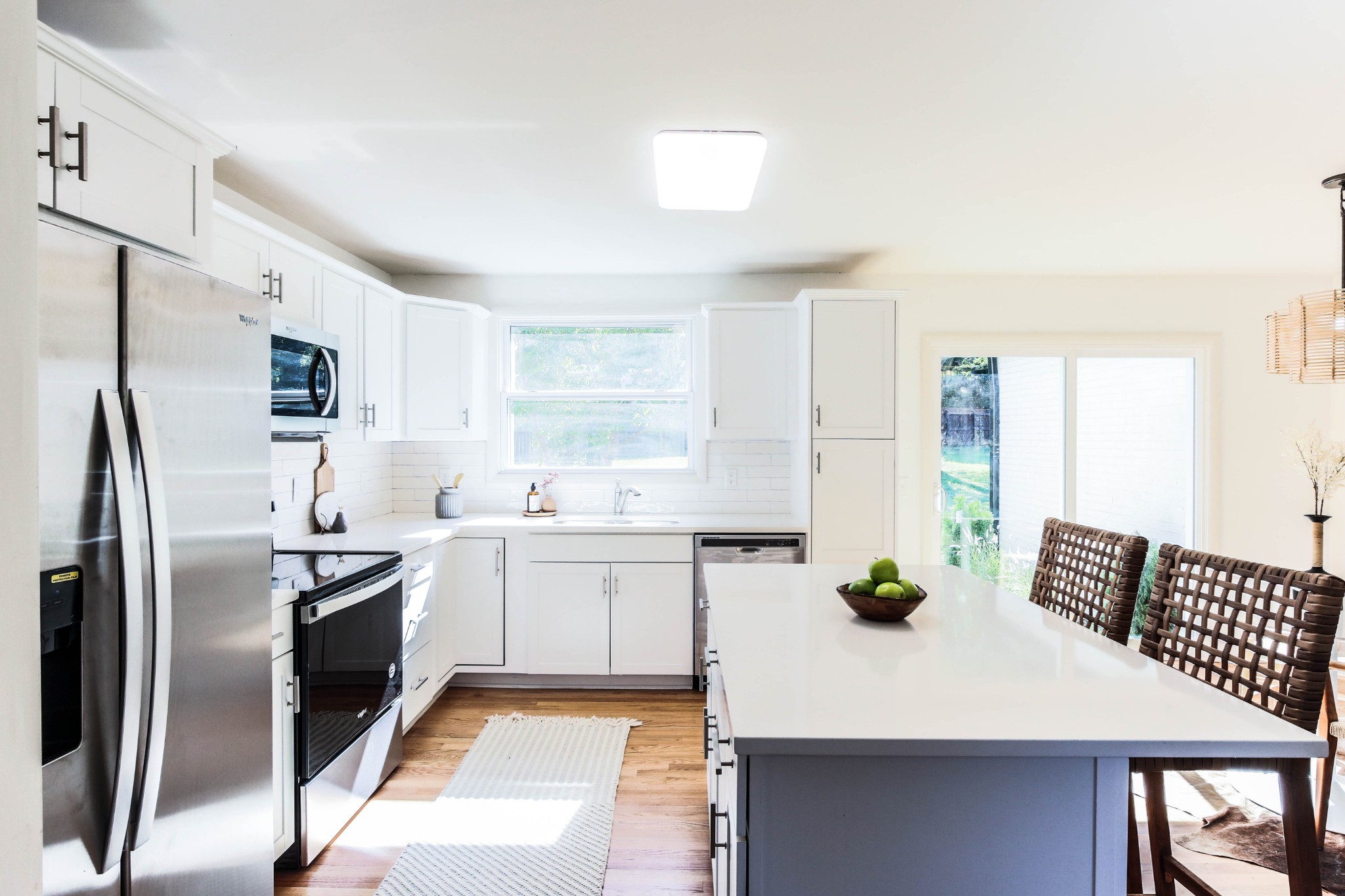 3826 East Ridge Drive Nashville, TN 37211 - Photo 4 of 10 a kitchen with white cabinets and stainless steel appliances