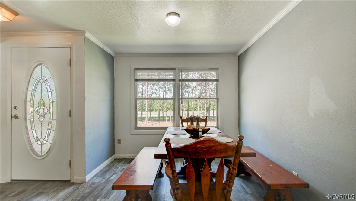1694 Rolling Acres Road Emporia, VA 23847 - Photo 11 of 45 Dining space with crown molding and hardwood / woo