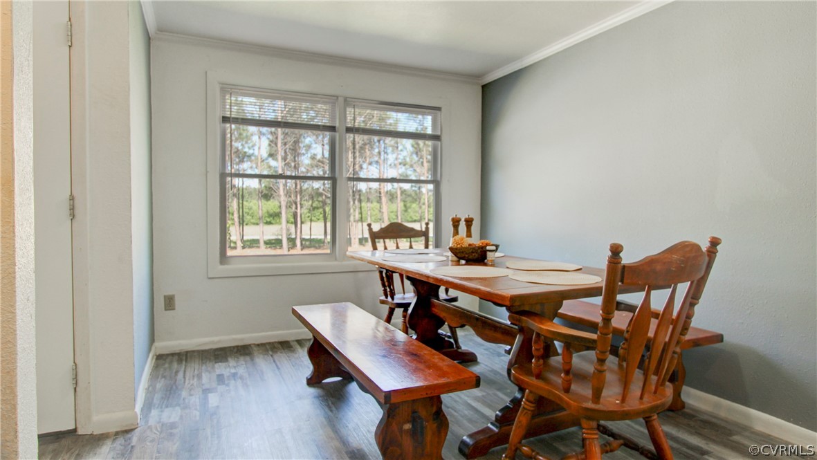 1694 Rolling Acres Road Emporia, VA 23847 - Photo 12 of 45 Dining space with ornamental molding and hardwood