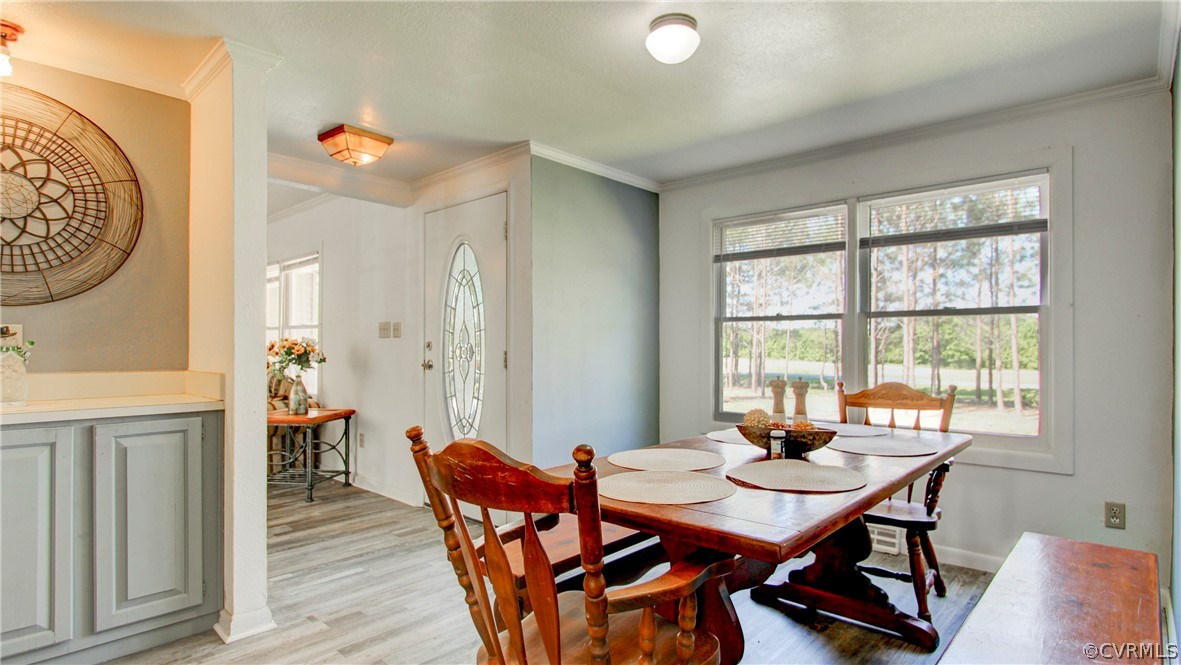 1694 Rolling Acres Road Emporia, VA 23847 - Photo 13 of 45 Dining room with light wood-type flooring and orna