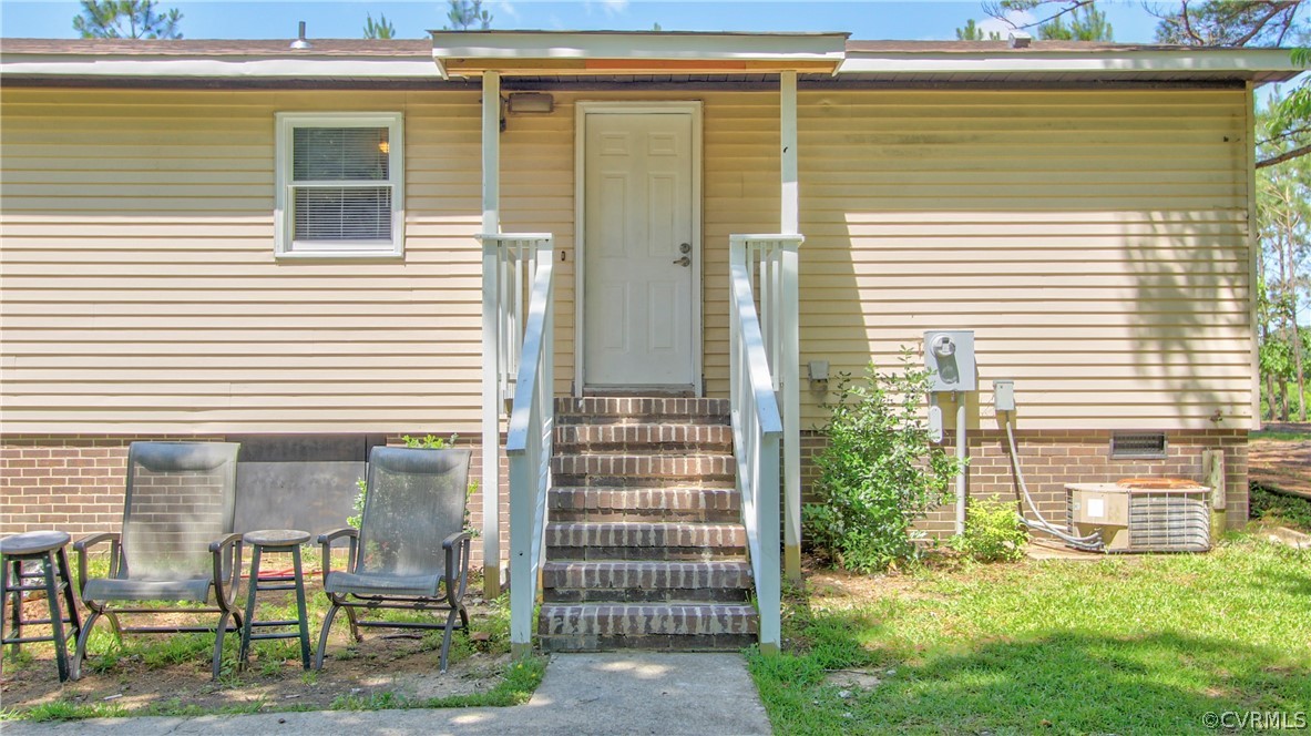 1694 Rolling Acres Road Emporia, VA 23847 - Photo 42 of 45 View of front facade with central AC unit