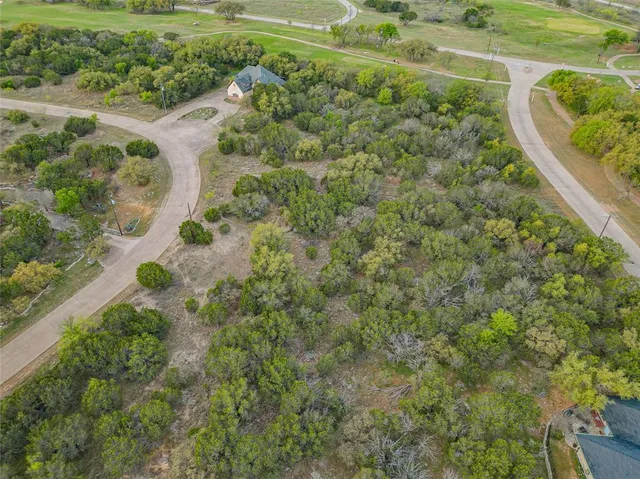 a view of a lake with a yard