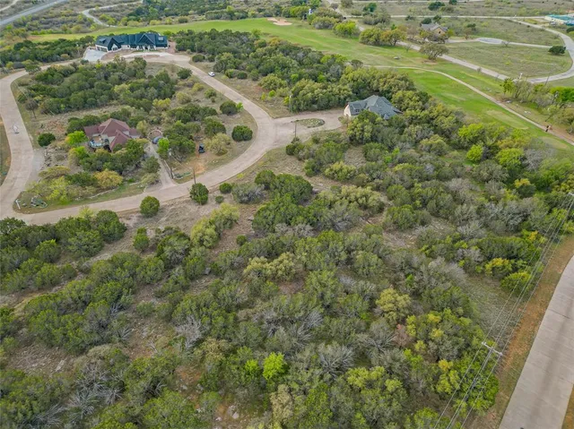 a view of a lake with a yard