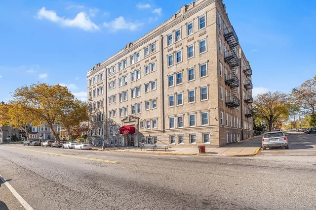a view of a building with a street