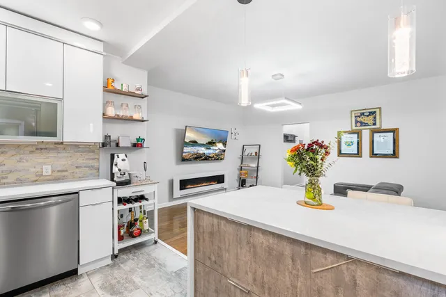 a kitchen with a sink appliances and cabinets