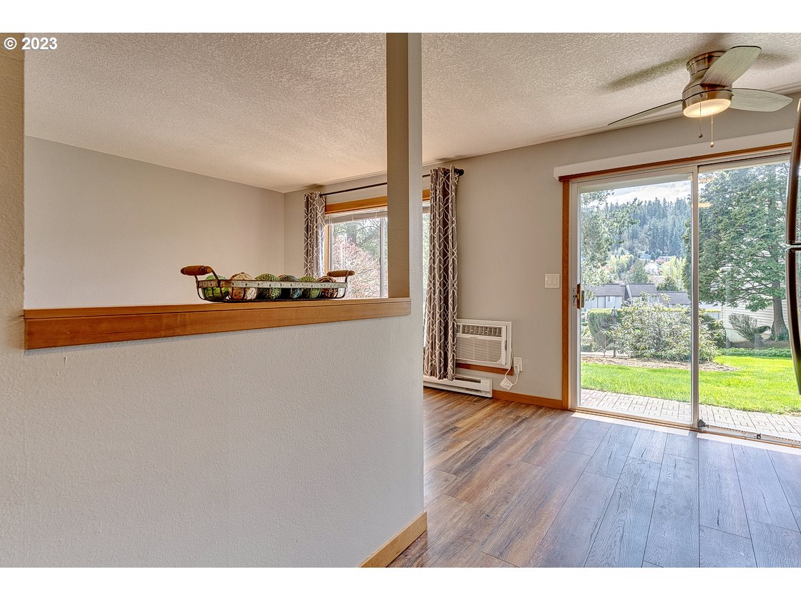 200 Southwest Florence Avenue, Unit C9 Gresham, OR 97080 - Photo 16 of 32 a view of a room with wooden floor and a window