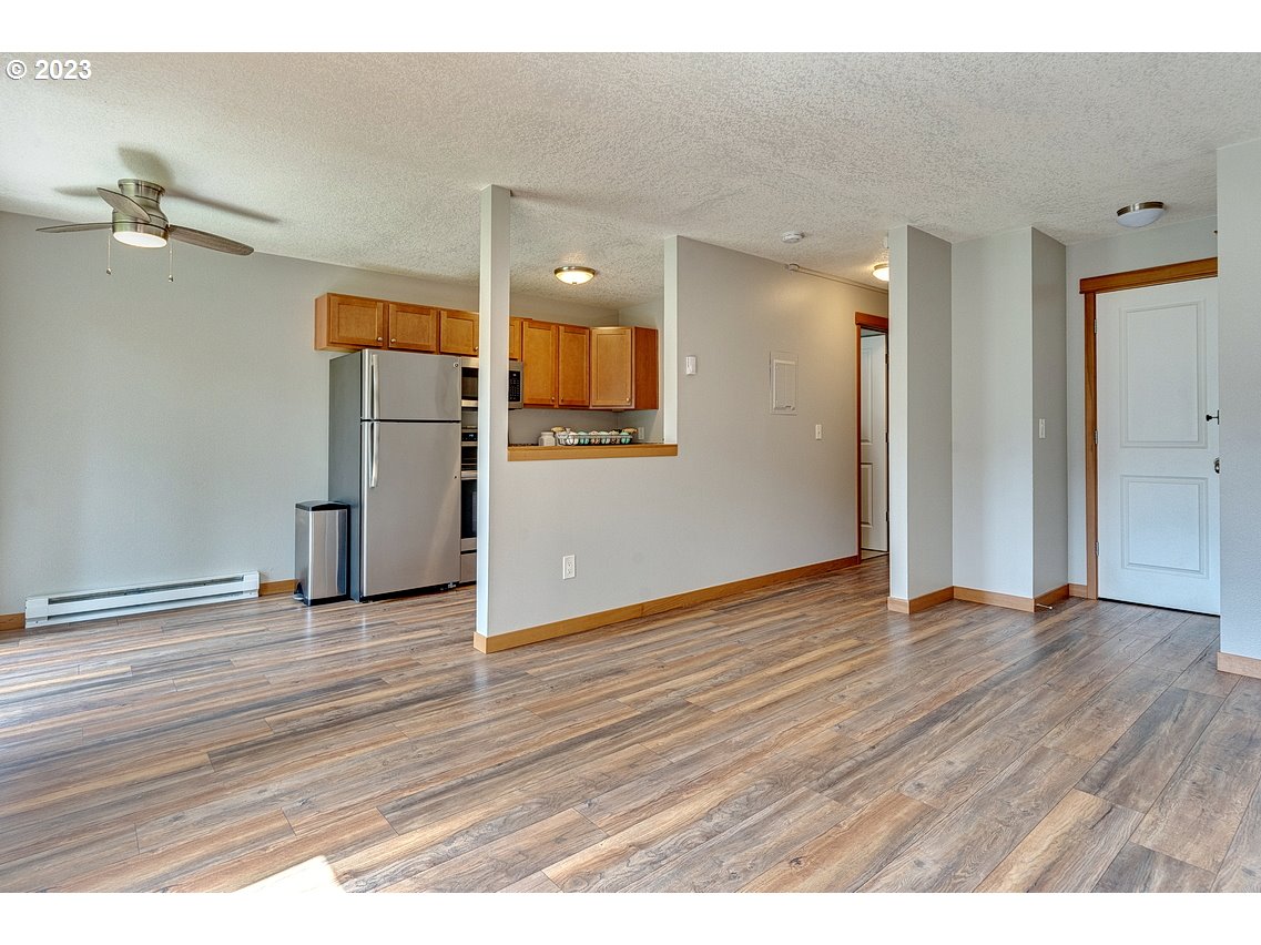 200 Southwest Florence Avenue, Unit C9 Gresham, OR 97080 - Photo 8 of 32 a view of empty room with wooden floor
