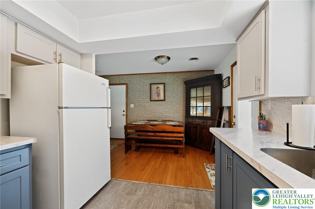3541 Lumar Street Orefield, PA 18069 - Photo 14 of 30 a kitchen with a refrigerator and a sink