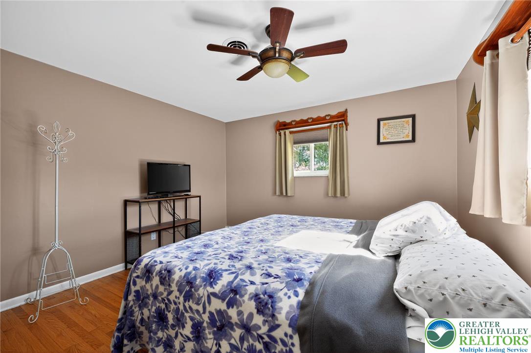 3541 Lumar Street Orefield, PA 18069 - Photo 17 of 30 a bedroom with a bed and a tv
