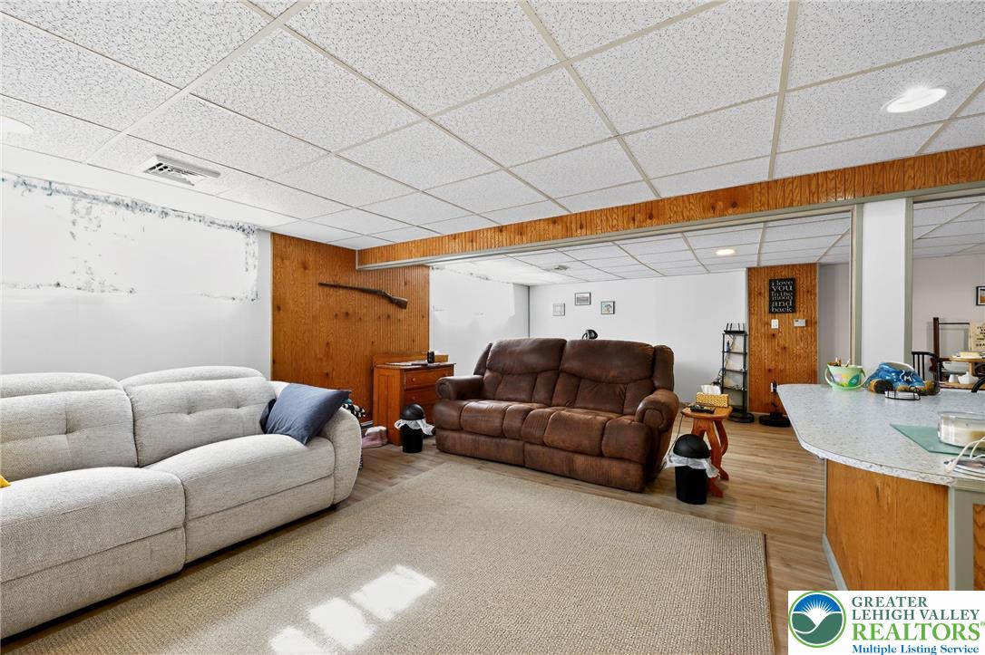 3541 Lumar Street Orefield, PA 18069 - Photo 23 of 30 a living room with furniture a couch and a potted plant