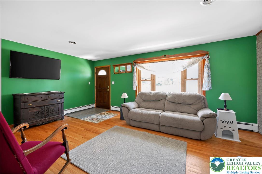 3541 Lumar Street Orefield, PA 18069 - Photo 8 of 30 a living room with furniture and a flat screen tv