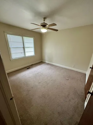 a room with furniture and a window