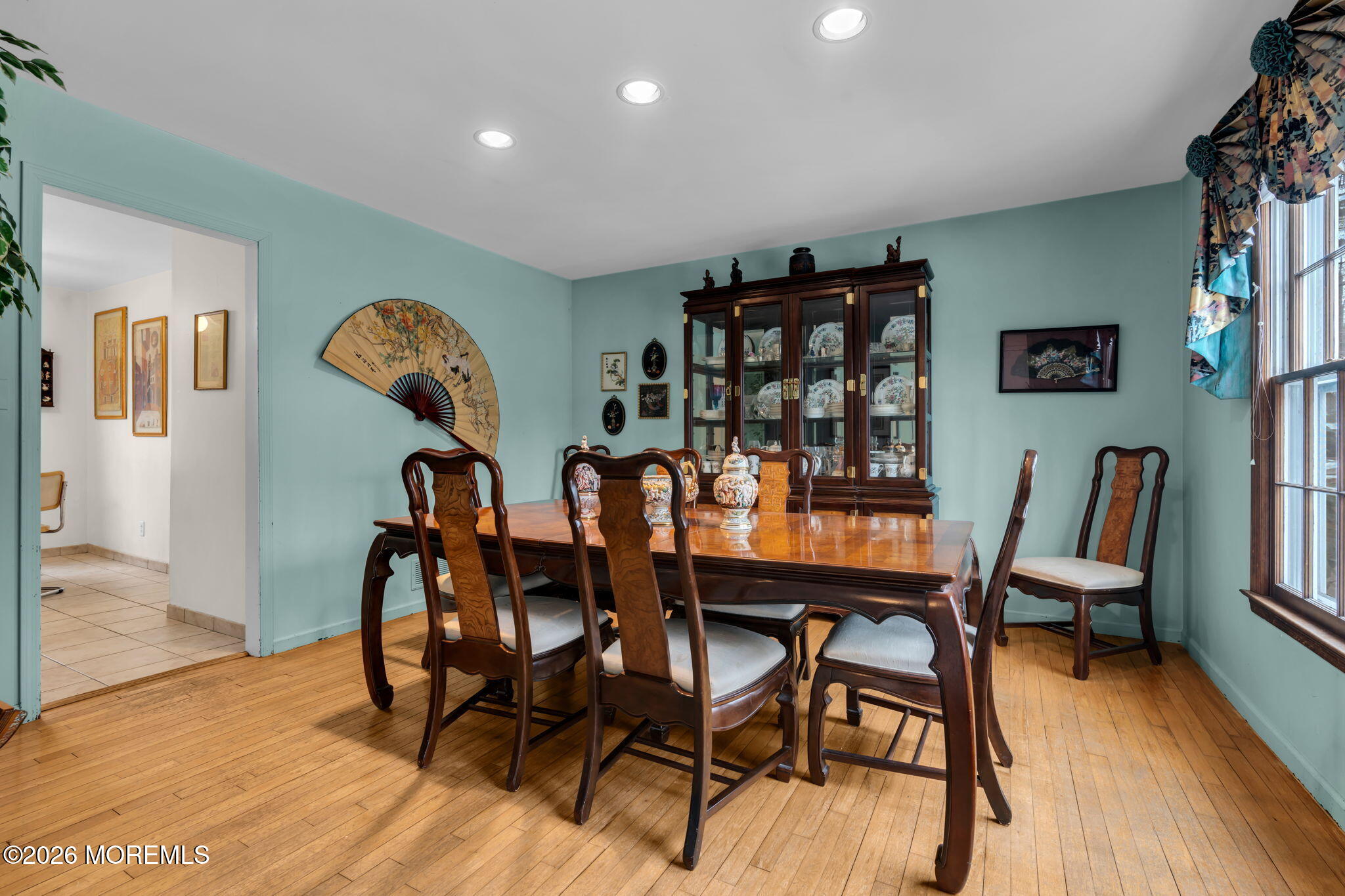 103 Reids Hill Road Morganville, NJ 07751 - Photo 12 of 44 a dining room with furniture and wooden floor