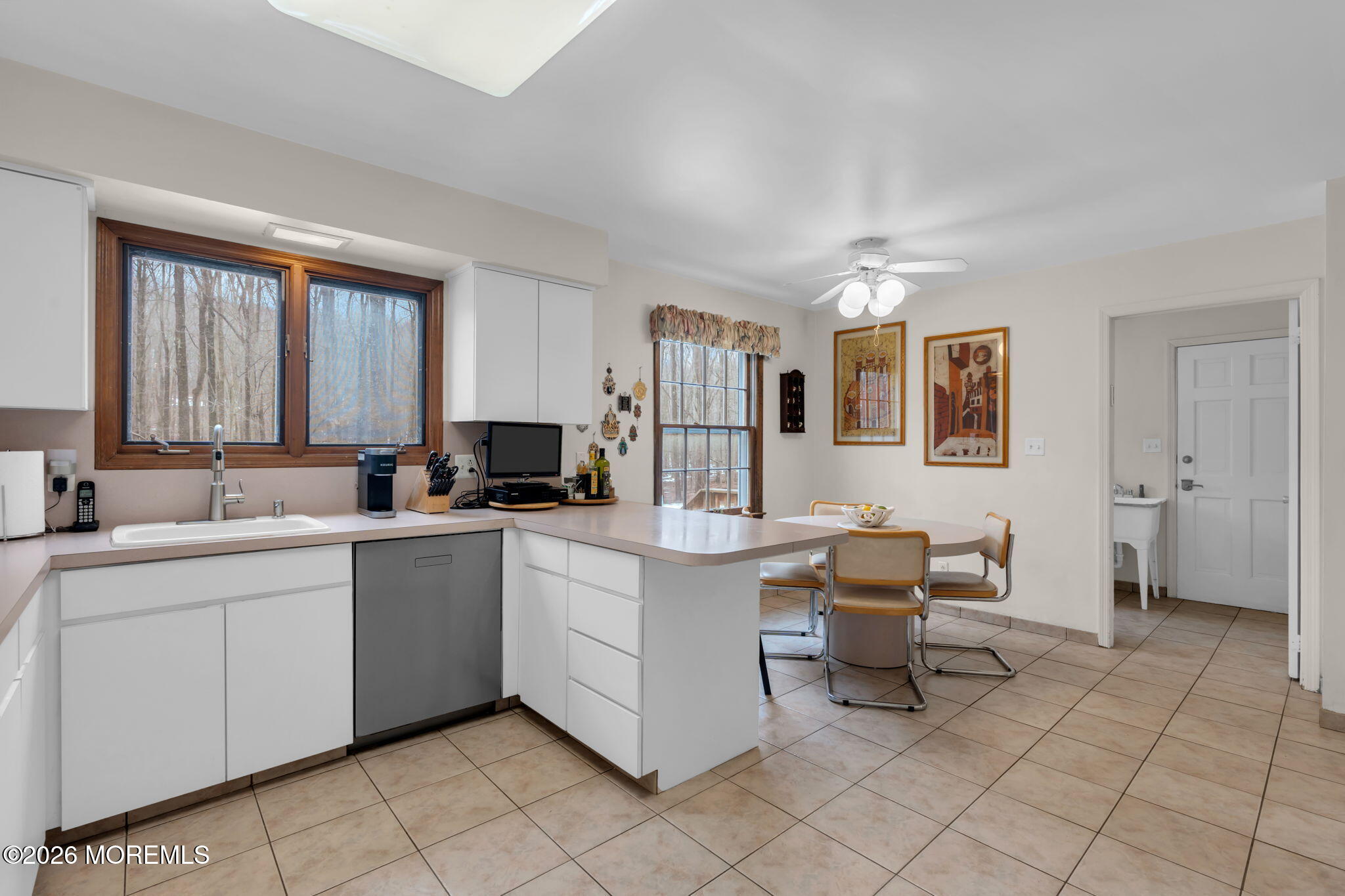 103 Reids Hill Road Morganville, NJ 07751 - Photo 18 of 44 a living room with furniture a dining table and a sink
