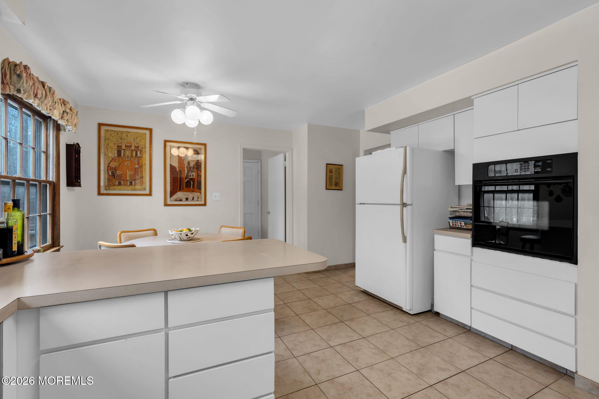 103 Reids Hill Road Morganville, NJ 07751 - Photo 19 of 44 a kitchen with stainless steel appliances a refrigerator sink and stove