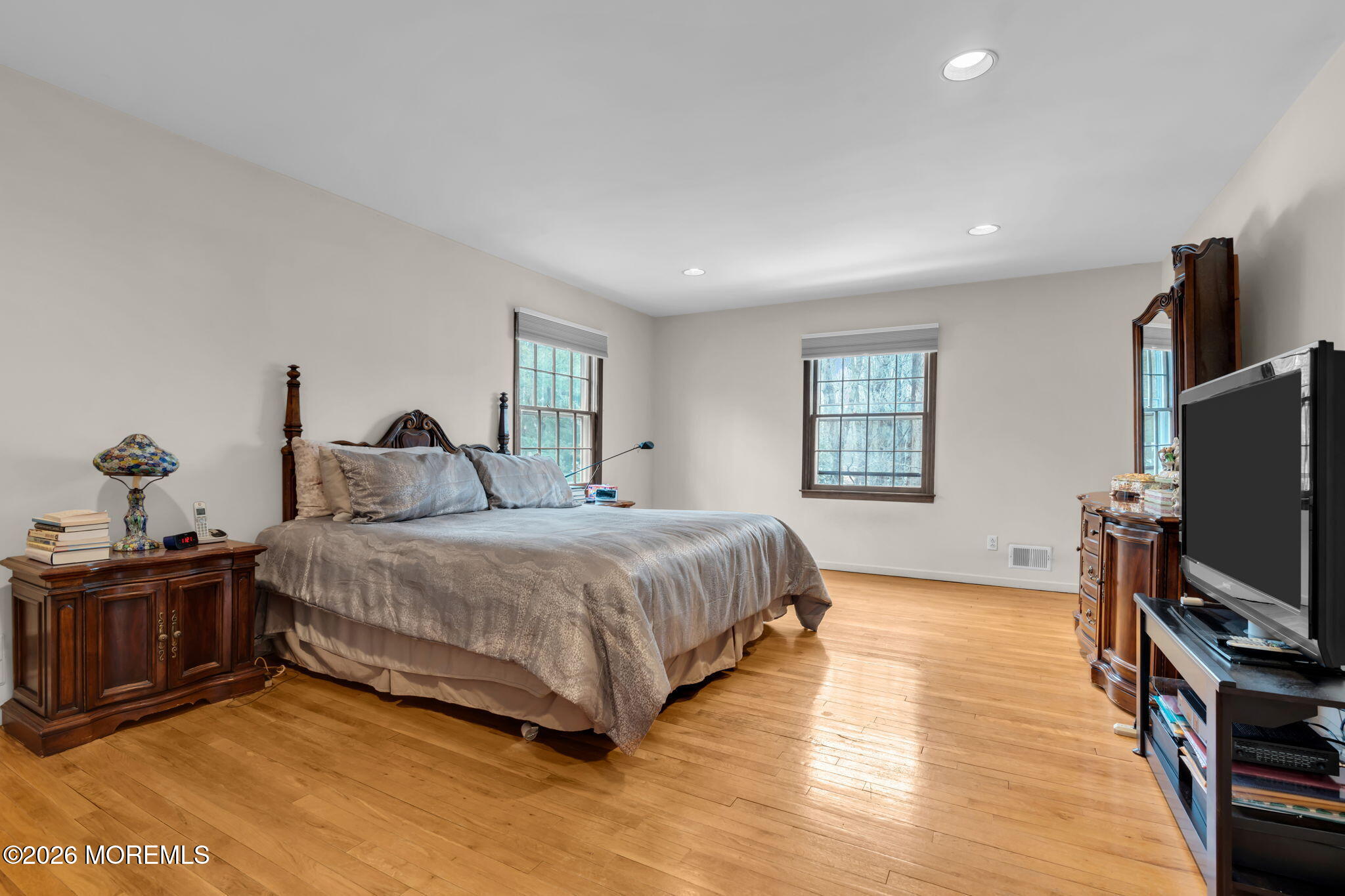 103 Reids Hill Road Morganville, NJ 07751 - Photo 33 of 44 a bedroom with a bed and a flat screen tv