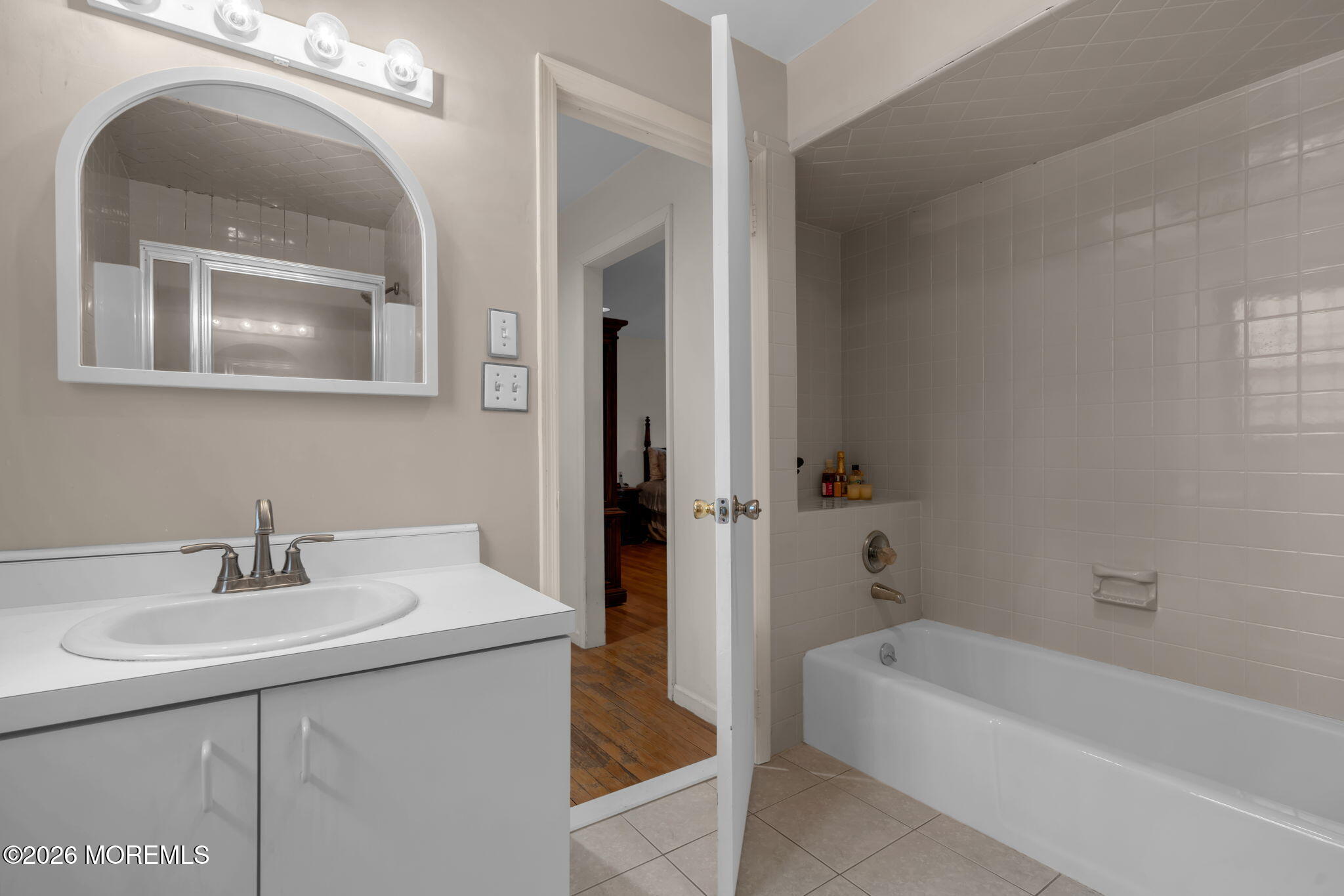 103 Reids Hill Road Morganville, NJ 07751 - Photo 36 of 44 a bathroom with a sink a toilet and bathtub