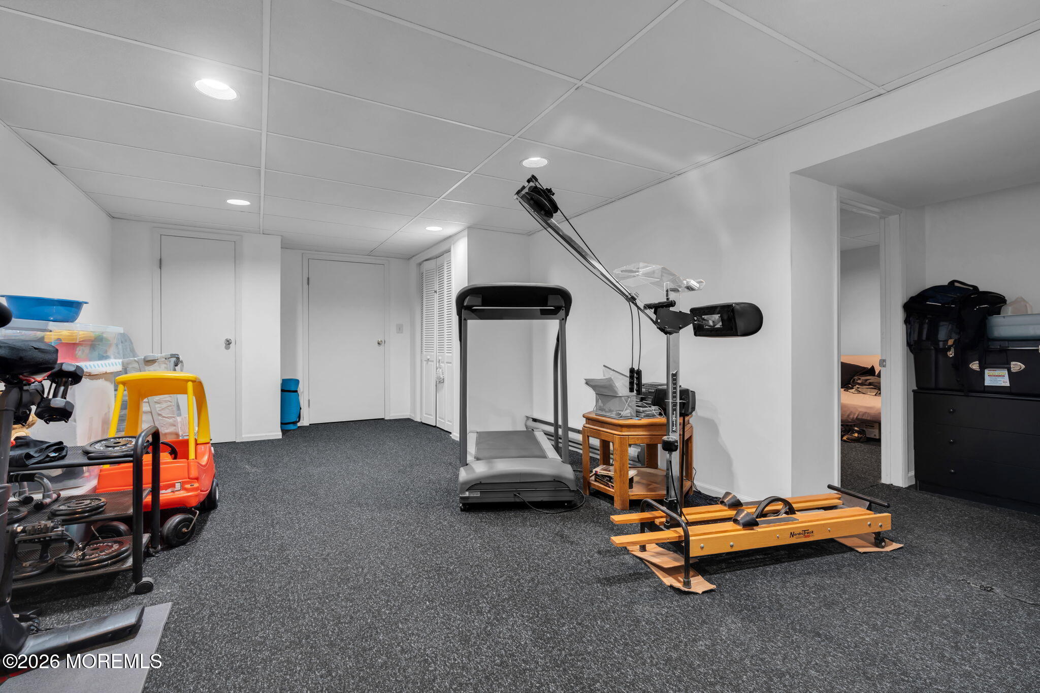 103 Reids Hill Road Morganville, NJ 07751 - Photo 40 of 44 a room with gym equipment and windows