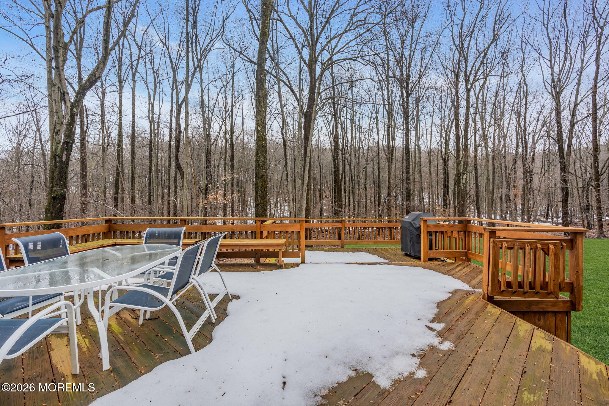 103 Reids Hill Road Morganville, NJ 07751 - Photo 10 of 44 a view of a patio with table and chairs with wooden floor and fence