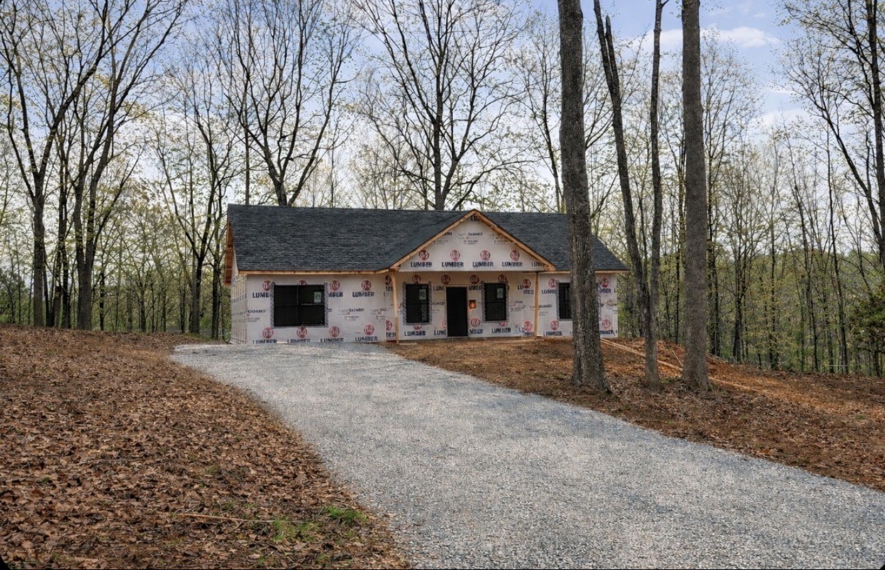 352 Pulley Street Erin, TN 37061 - Photo 1 of 1 a front view of a house with a garden