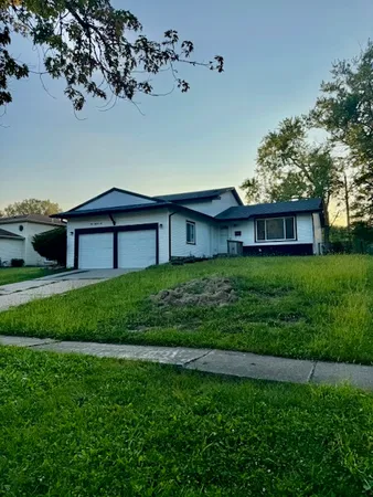 a view of a house with a big yard