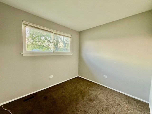 906 Blackhawk Drive University Park, IL 60484 - Photo 3 of 13 an empty room with a window