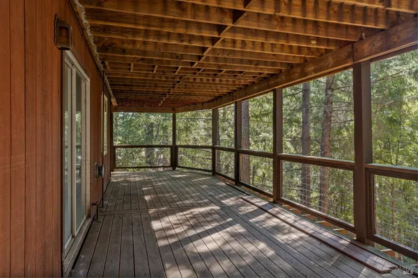 a view of porch with wooden floor