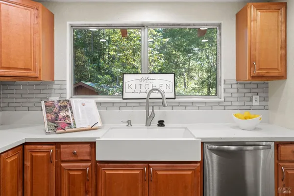 a kitchen with a sink and a window