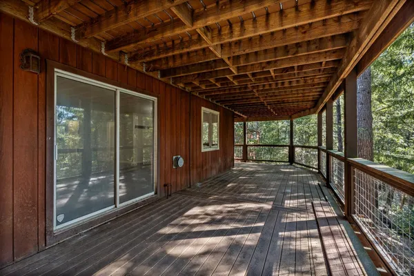 a view of porch with wooden floor