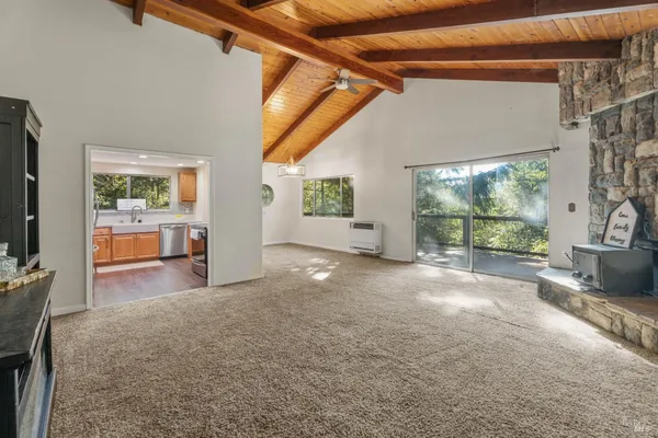 a view of livingroom with furniture and floor to ceiling window