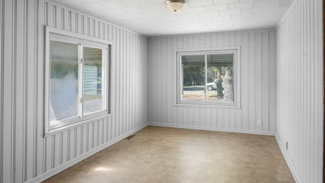 a view of an empty room with a window