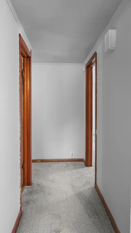 a view of an empty room and window