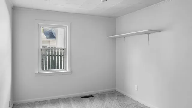 a view of a bathroom with a shower and a sink