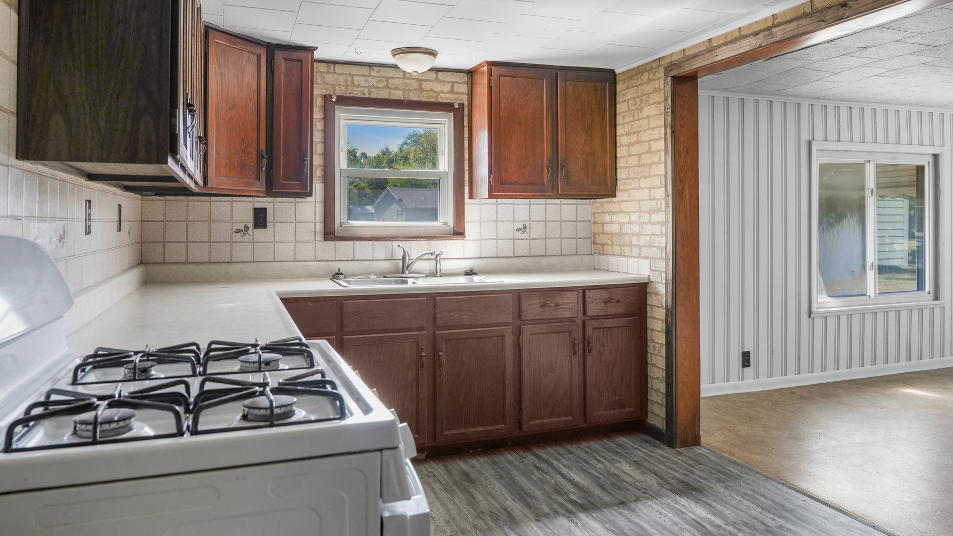913 Forrest Street Danville, IL 61832 - Photo 8 of 29 a kitchen with a sink stove and cabinets