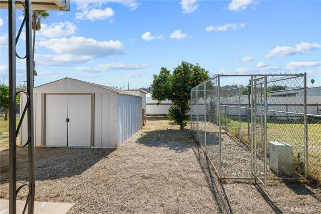 a swimming pool with yard and outdoor seating