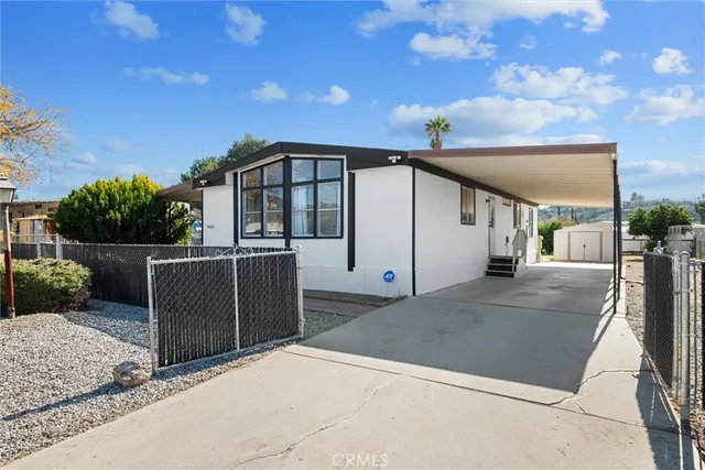 a view of a wrought iron fences in front of house