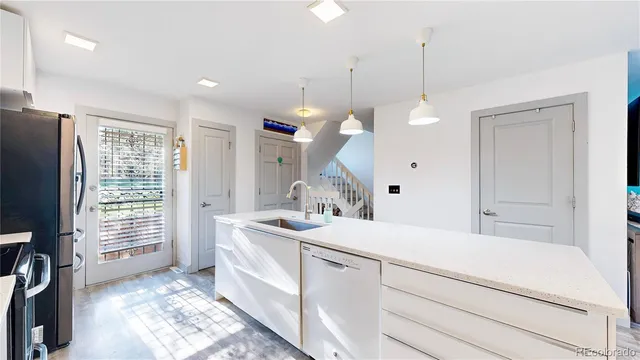 a bathroom with a sink a large mirror and a shower