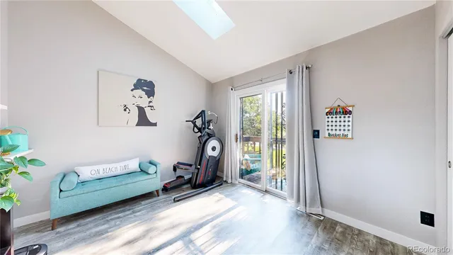 a bedroom with furniture and a window